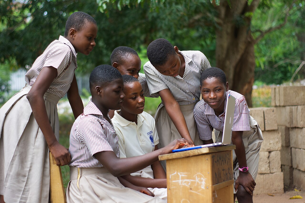 A group of students using a computer laptop.jpg